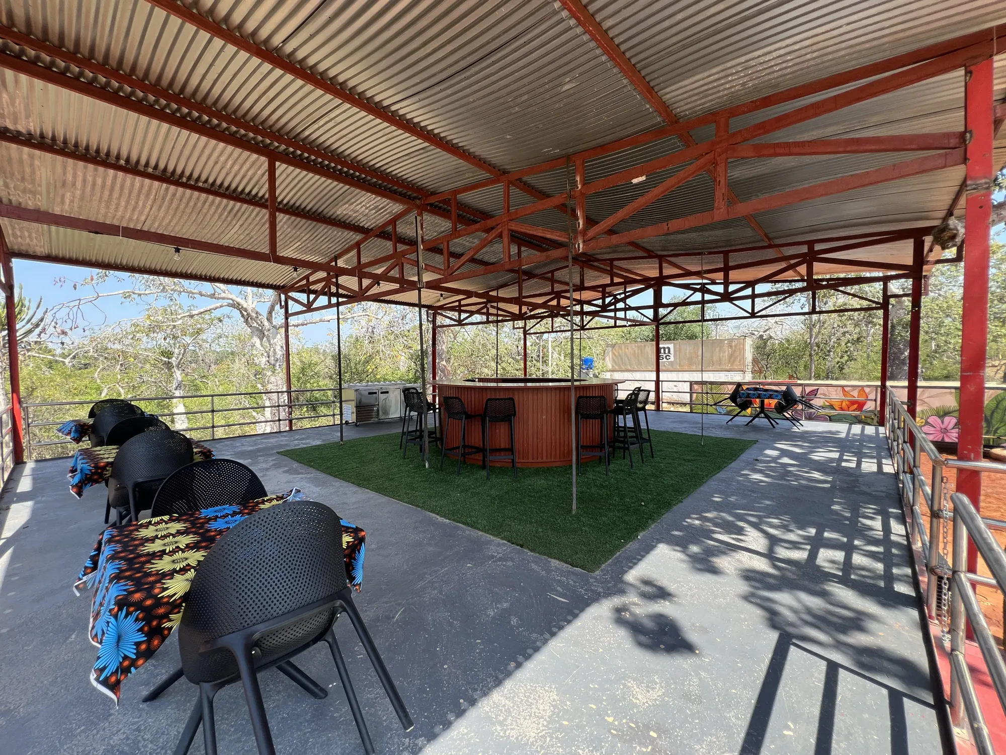 Riverside bar deck with seating overlooking the Kwanza River