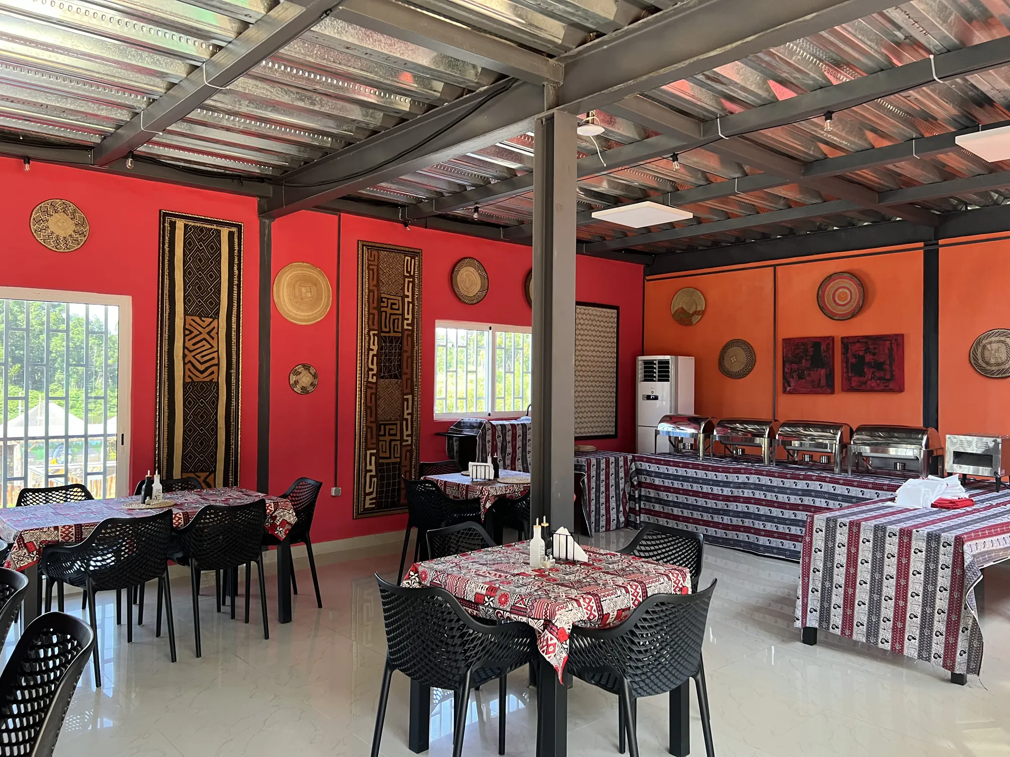African-inspired dining room with traditional woven wall art