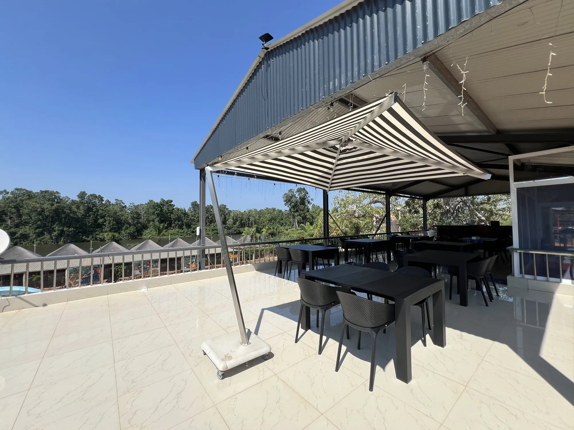 Evening dining terrace overlooking the Kwanza River